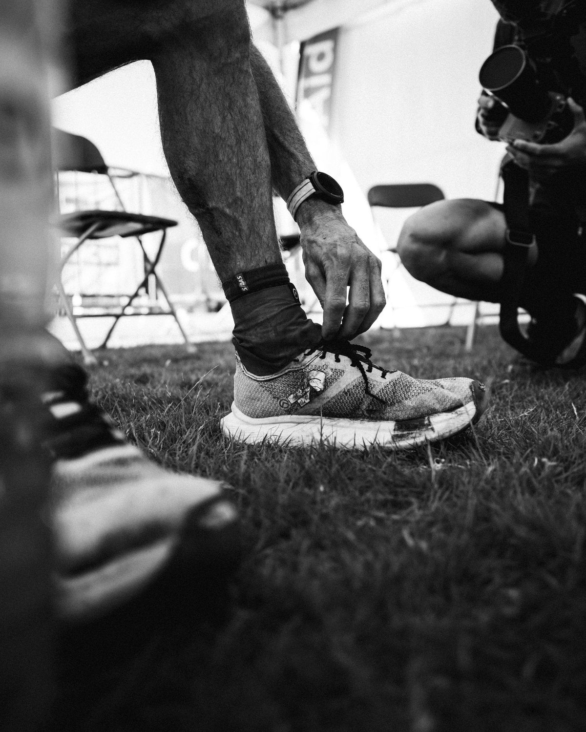 Ultra runner eating real food at an aid station mid-race